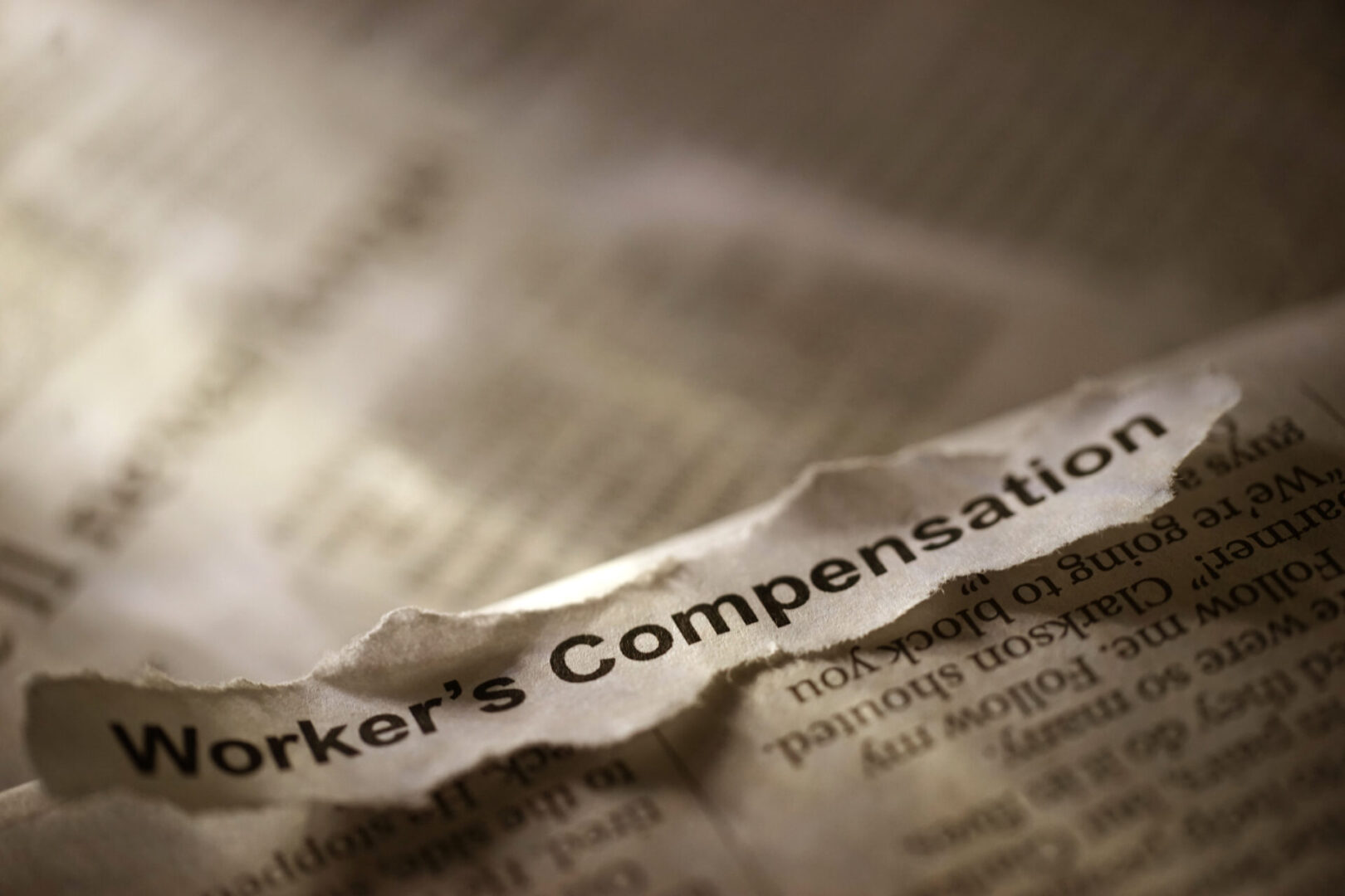 A close up of the words " worker 's compensation ".