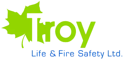 Logo for "Troy Life & Fire Safety Ltd." The word "Troy" is in green with a leaf behind the "T". "Life & Fire Safety Ltd." appears in blue below, reflecting values like employee compensation and workplace wellbeing.